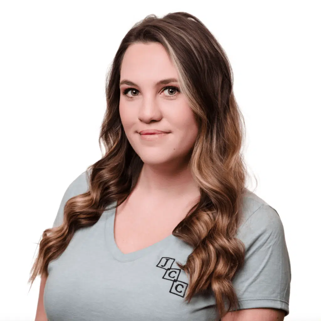 Headshot of Alexis Norman, a bookkeeping and payroll specialist at Jones, Covey, and Company in Washington, NC. Alexis provides reliable support for local businesses, managing payroll and maintaining accurate financial records. She is wearing a light gray shirt with the firm's logo and smiling against a white background.